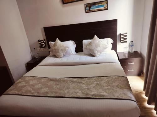 Vrindavan suites And Resortにあるベッド