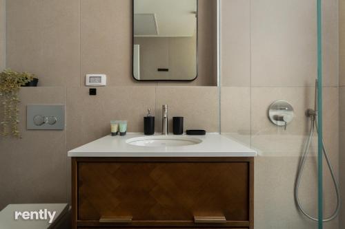 a bathroom with a sink and a mirror at Eilat 42-by rently in Eilat