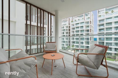 a room with two chairs and a table and windows at Eilat 42-by rently in Eilat
