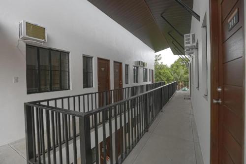 an empty hallway of a school building with a hallway at OYO 736 Jade Apartelle in Calamba