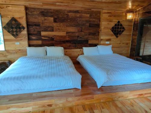 Postel nebo postele na pokoji v ubytování Ura Ura Homestay