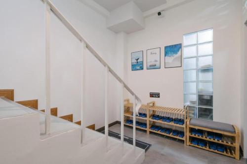 a room with stairs and benches in a building at Blue rabbit phuket in Ban Tha Khreng