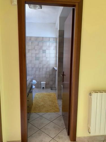 a bathroom with a sink and a toilet in a room at Casa relax e vacanza Il Moraiolo in Stroncone
