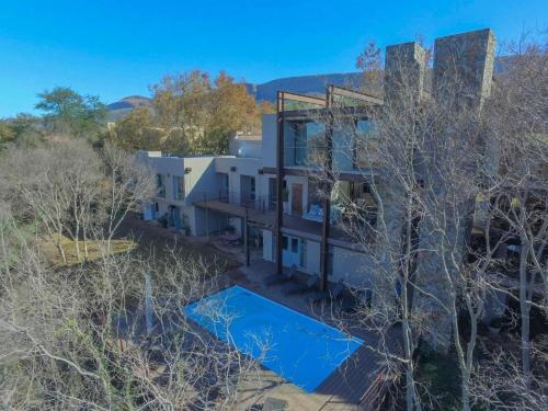 an aerial view of a white house with trees at La Serenita @ Migdash in Hartbeespoort