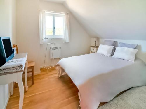 a bedroom with a large white bed and a desk at Holiday Home in Treignes for 9 Person in Treignes