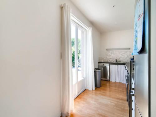 a room with a kitchen with a large window at Holiday Home in Treignes for 9 Person in Treignes