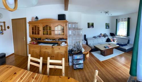 a living room with a couch and a table at Ferienhaus Fuchsbau Hohentauern in Hohentauern