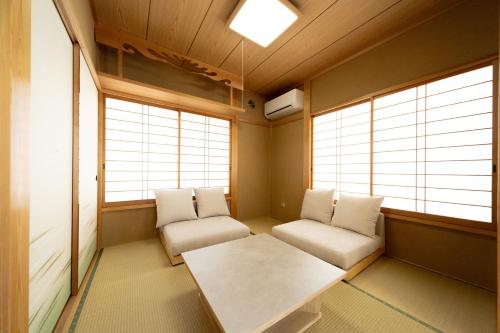 a meditation room with two chairs and a table at rinne 熱海 Retreat in Atami