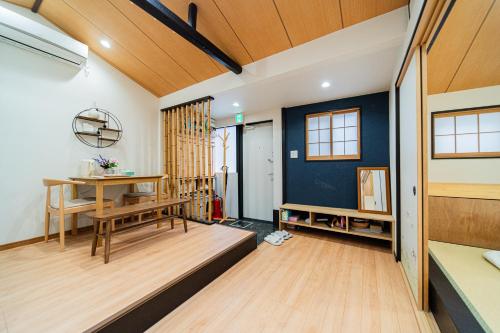 a living room with a table and a desk at 夏様賀陽御所 Cozy Kyoto Machiya, 4 min walk Shijo Omiya,Perfect for 3 Guests in Kyoto