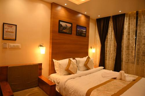 Katil atau katil-katil dalam bilik di Hotel Golden Potala