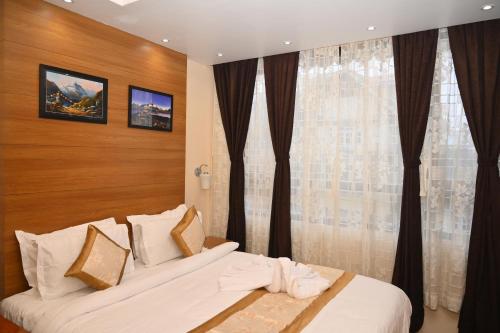 Katil atau katil-katil dalam bilik di Hotel Golden Potala