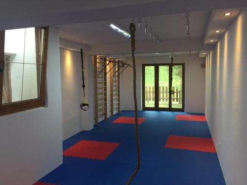 a room with a blue floor and a rope at Frühstückspension Christina in Tux