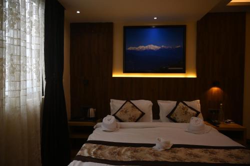 Katil atau katil-katil dalam bilik di Hotel Golden Potala