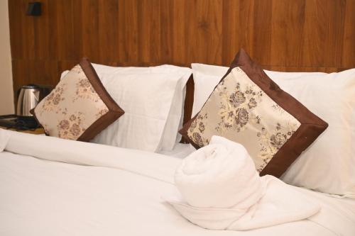 Katil atau katil-katil dalam bilik di Hotel Golden Potala