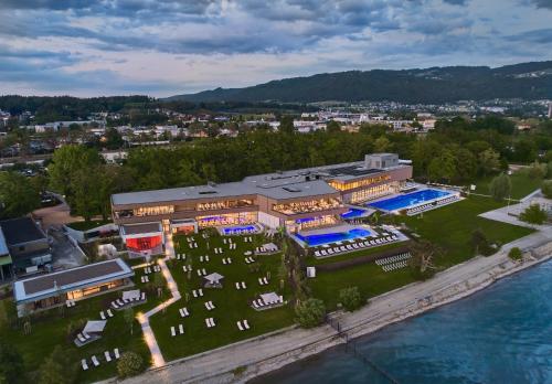 an aerial view of a building next to the water at Hotel Alte Schule in Lindau