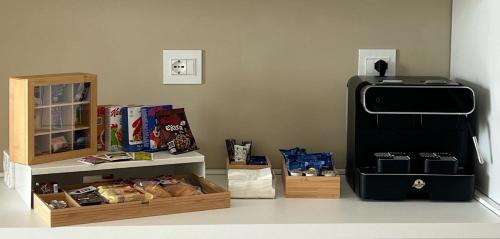 a room with a refrigerator and boxes of food at SunBeach 44 - Skyview B&B in Melito di Porto Salvo