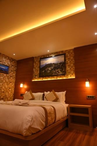 Katil atau katil-katil dalam bilik di Hotel Golden Potala