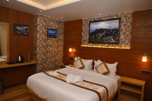 Katil atau katil-katil dalam bilik di Hotel Golden Potala
