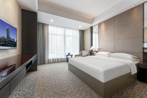 Katil atau katil-katil dalam bilik di Ningbo BTG Nanyuan Yunhui Hotel
