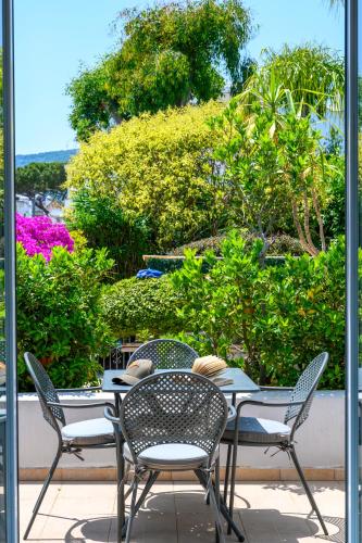 a table and chairs sitting on a patio at Hotel Villa Durrueli Resort & Spa in Ischia