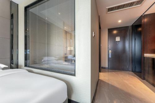 Katil atau katil-katil dalam bilik di Ningbo BTG Nanyuan Yunhui Hotel