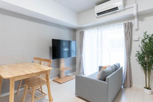 Μια τηλεόραση ή/και κέντρο ψυχαγωγίας στο Ekimae apartment