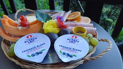 a basket of fruits and vegetables on a table at Le Jardin D' Épicure in Oderen