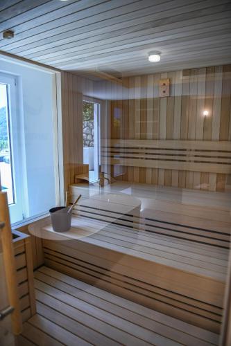 a sauna with a tub in the middle of a room at Santa Boka in Perast