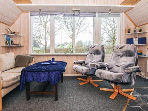 a living room with a couch and two chairs and a table at 5 person holiday home in Grindsted in Tofterup