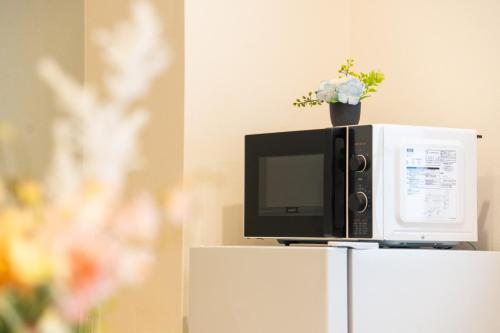 Μια τηλεόραση ή/και κέντρο ψυχαγωγίας στο 夏様小倉町 Convenient house, private house, 5-minute walk from Nijo station