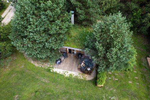 an overhead view of a backyard with a house at Männisalu cozy houses with hot tube and many extras 