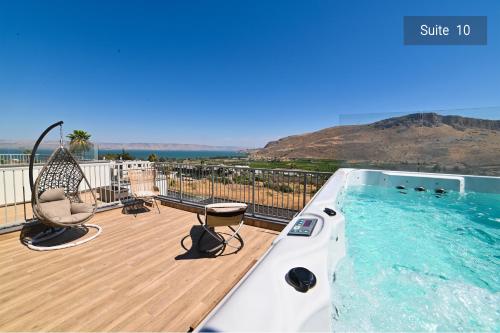 a swimming pool on a deck with a view at Galilee Escape Private Pool or Jacuzzi Retreat in Migdal