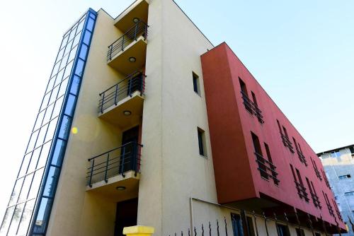 a building with balconies on the side of it at Hotel Imperial Timisoara by JR in Timişoara
