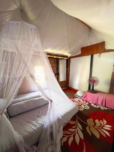 Postel nebo postele na pokoji v ubytování Davi homestay