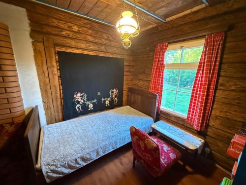 Ein Bett oder Betten in einem Zimmer der Unterkunft Pärtli-Jaani Elukoda