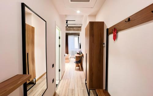 a hallway of a house with a door and a room at Rooms Apart Hotel by RED in Yerevan