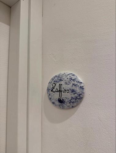 a stone on a door with the word exit on it at CaLaDream B&B in Trebisacce