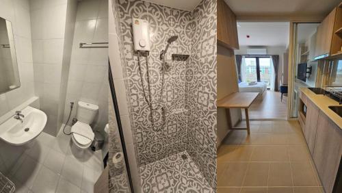 a bathroom with a shower with a toilet and a sink at Cabanas Huahin by PTA in Hua Hin