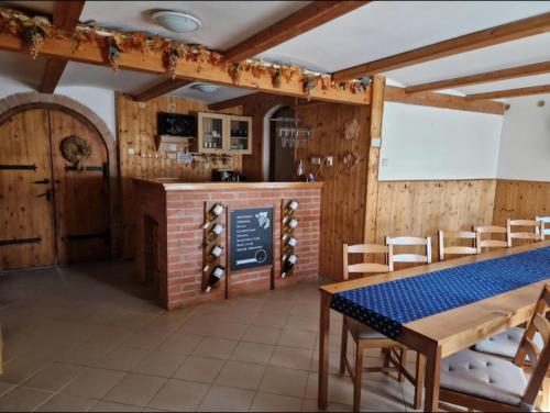 a tasting room with a table and chairs at Sklep u Veselých in Mutěnice