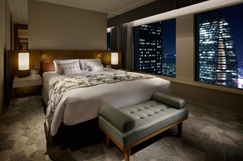 a large bedroom with a large bed and a window at Keio Plaza Hotel Tokyo in Tokyo