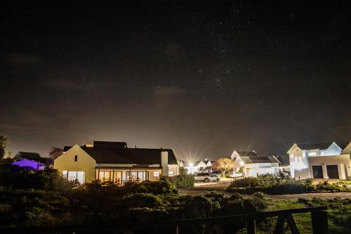 a row of houses at night with a starry sky at Kelkiewyn in Yzerfontein in Yzerfontein