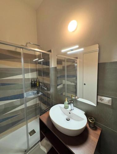 a bathroom with a sink and a shower at CaLaDream B&B in Trebisacce