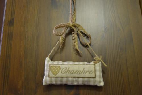a towel hanging on a wall with a heart on it at Casa Mortarino in Bozzole