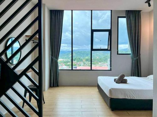 Katil atau katil-katil dalam bilik di Hush Inn at ITCC Manhattan Suites