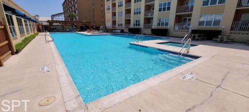 a swimming pool in the middle of a building at Gulfview I #205 in South Padre Island