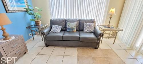 a leather couch sitting in a living room at Gulfview I #205 in South Padre Island