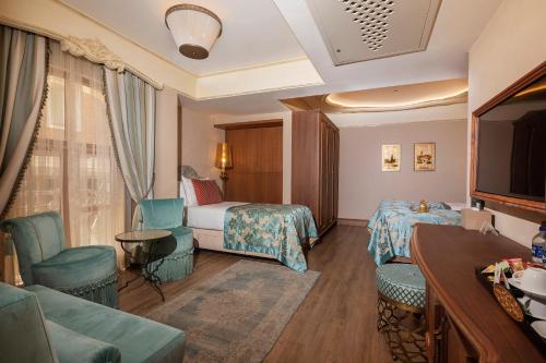 a hotel room with a bed and a couch at Romance Istanbul Hotel Boutique Class in Istanbul