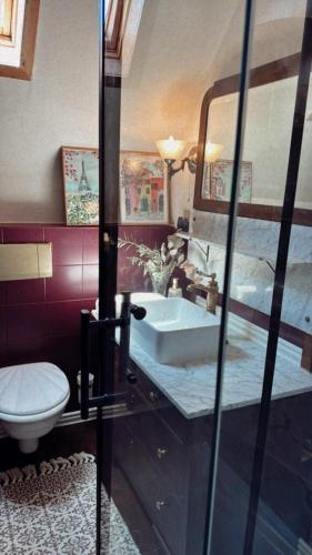 a bathroom with a sink and a toilet at La!Maison am Rhein in Trebur