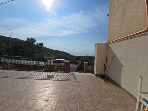 a balcony with a view of a parking lot at Dal Falegname in Roccalumera