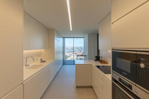 Η κουζίνα ή μικρή κουζίνα στο GuestReady - Urban luxury with Douro view